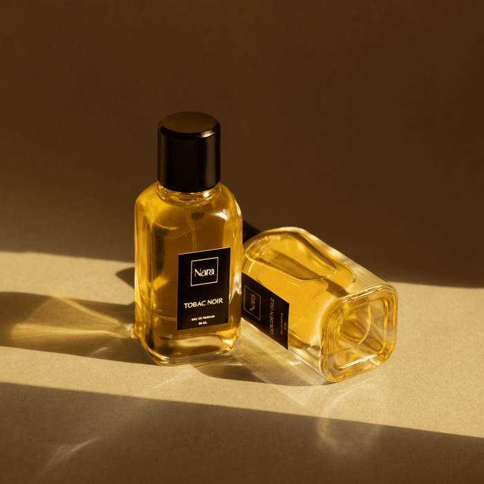 Experience the allure of "Tobac Noir," a luxurious eau de parfum blending sweet vanilla, smoky tobacco, warm spices, and cacao with a hint of ripe fruit. This captivating fragrance offers a powdery softness and woody depth, leaving a trail of intrigue and desire. Embrace the power of an unforgettable scent.